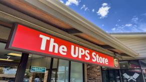 Exterior of a UPS store in close view of signage