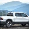 2019 Ram 1500 parked in right profile view in front of hazy mountains