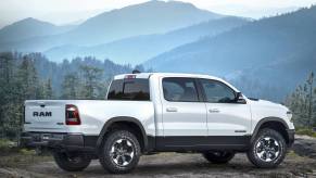 2019 Ram 1500 parked in right profile view in front of hazy mountains