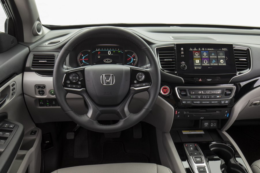 The interior view of a 2021 Honda Pilot with a Honda 3.5L V6 engine from the driver's perspective