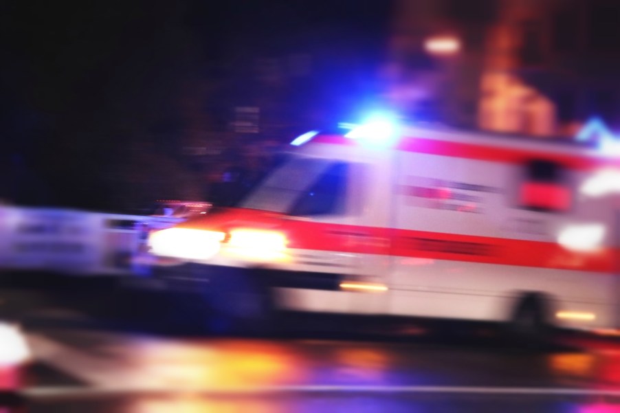 Ambulance with its lights on speeds through the Florida night.