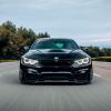 BMW M4 driver in the rearview mirror, tailgating.