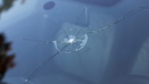 A broken windshield following a dangerous road rage event.