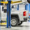 Chevrolet Silverado pickup truck in an auto shop for transmission failure.