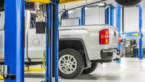 Chevrolet Silverado pickup truck in an auto shop for transmission failure.