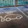 A row of EV charging spots in a garage.