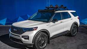 Special edition of a white Ford Explorer hybrid third row SUV.