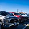 These new Ford F-150 trucks parked in a dealership lot command record high payments.