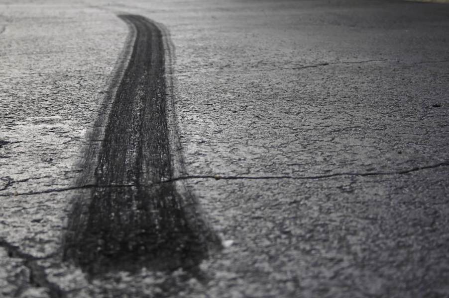 Burnout marks from a sub-10-second EV during a quarter mile drag race.