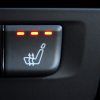 Heated seat button settings in a car in very close view