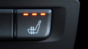 Heated seat button settings in a car in very close view