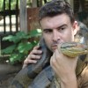 A man holding a large python