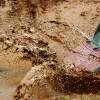 A truck splashing through mud