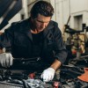 A mechanic working on a diesel truck