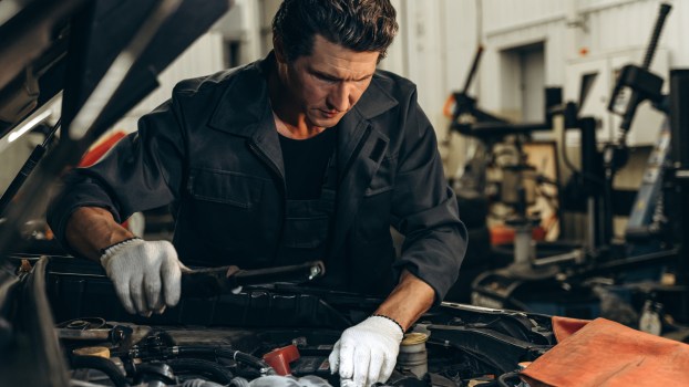 A mechanic working on a diesel truck