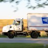 A U.S. Postal Service truck on the road