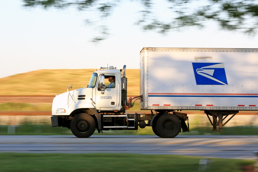 A U.S. Postal Service truck on the road