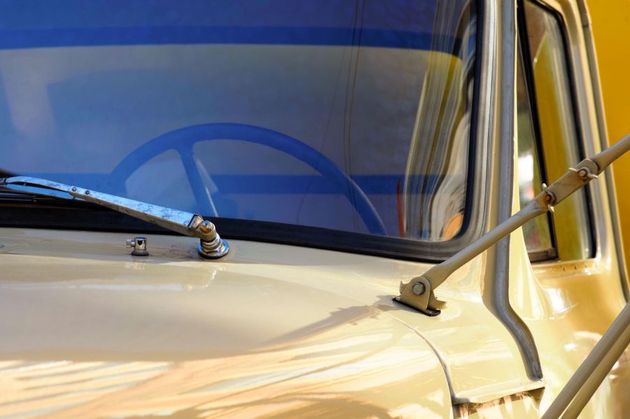 A vintage truck painted in a gold color