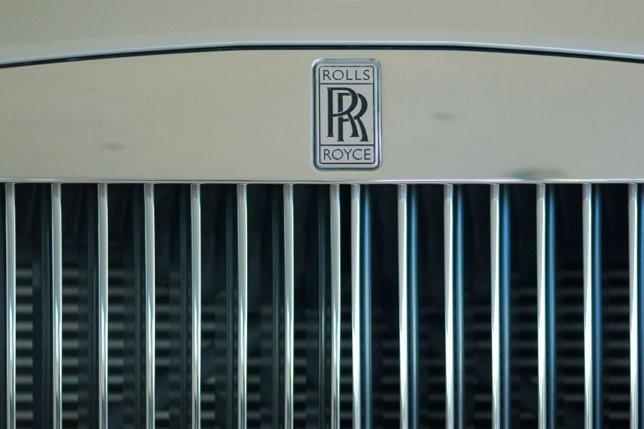 The front grille of a white Rolls Royce