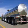 A silver tanker truck in rear view