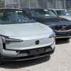 A 2025 Volvo EX90 EV sitting on a dealership lot