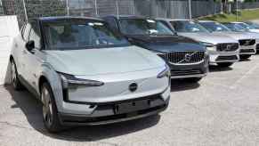 A 2025 Volvo EX90 EV sitting on a dealership lot